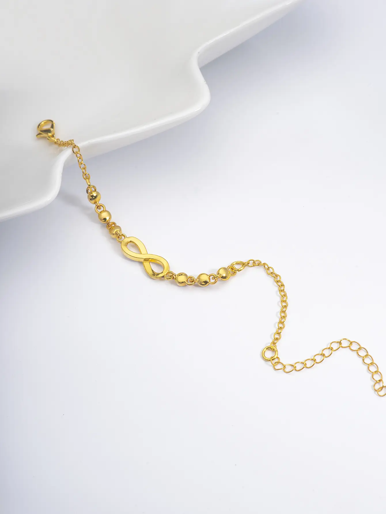 Geometric Infinity Loop 8-Character Charm Bracelet - Image 5